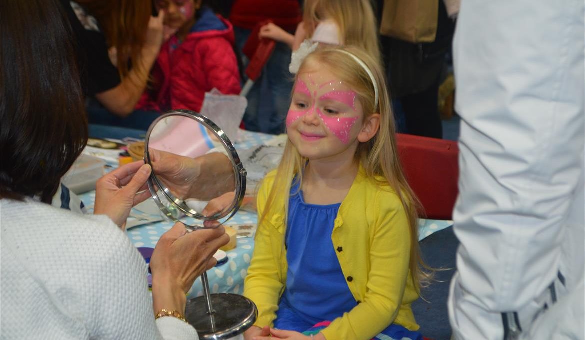 girl looking at her face paint