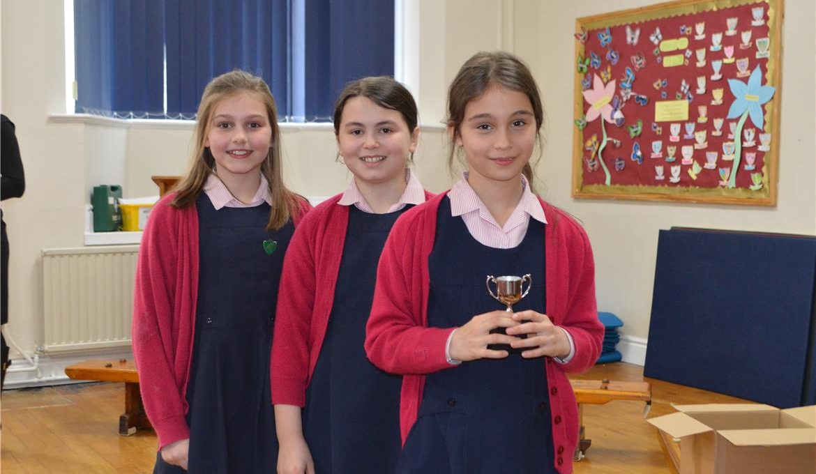 student holding a trophy