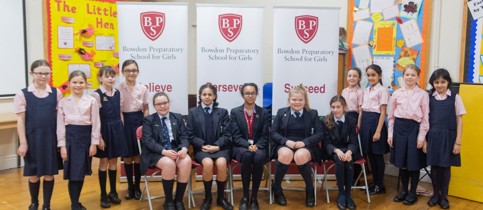 Group of students, some sittings and others standing