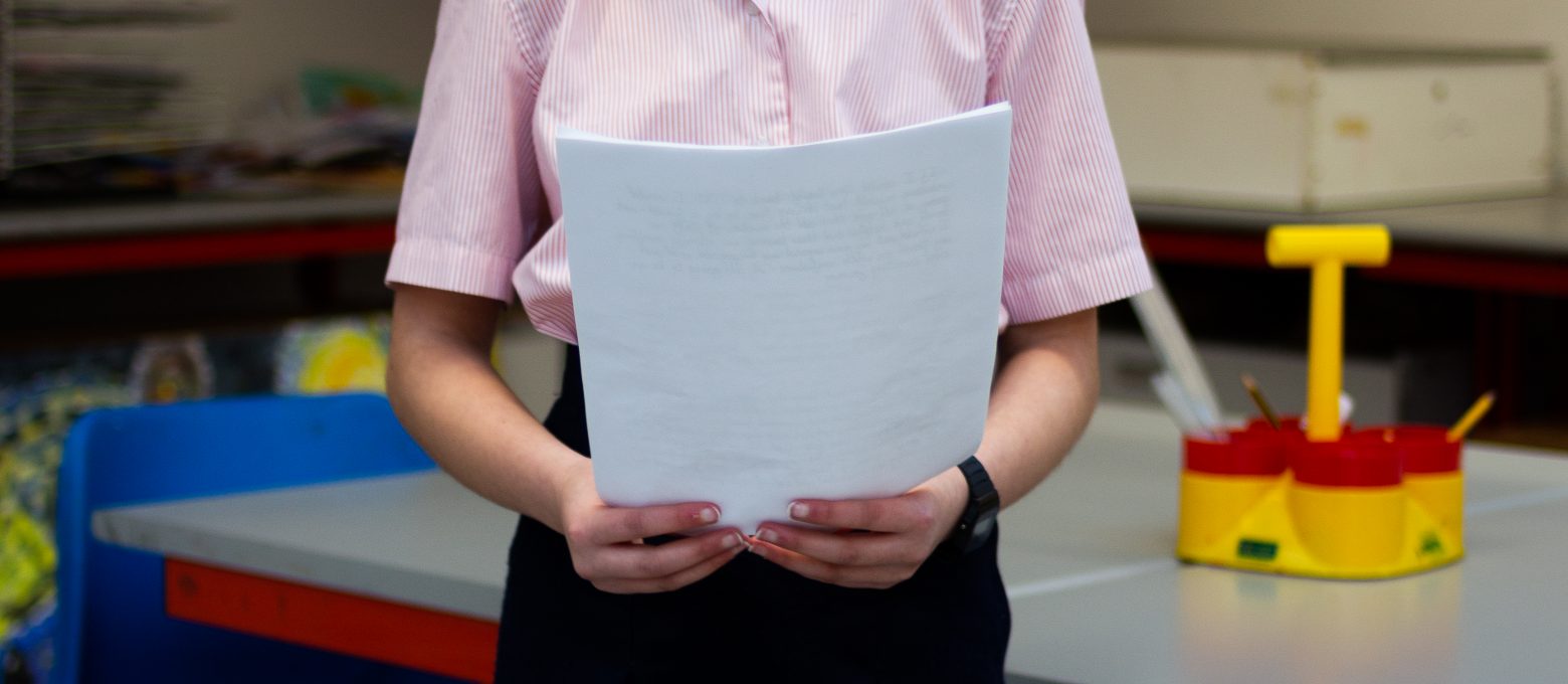 Girl holding a piece of paper