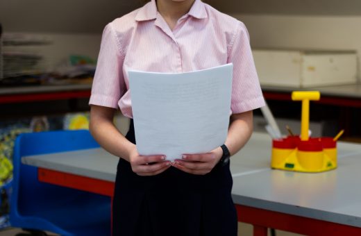 Girl holding a piece of paper