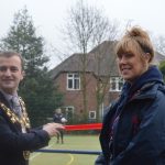 2 teachers cutting a ribbon