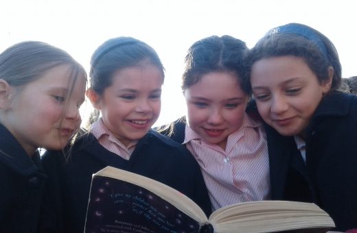 4 girls reading book