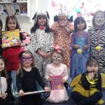 students and teachers in costumes