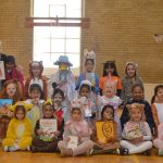 students and teachers in animal costumes