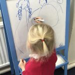 girl using a whiteboard