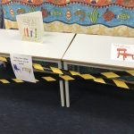 table with poster on top