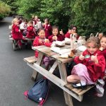 girls eating their lunch with thumbs up