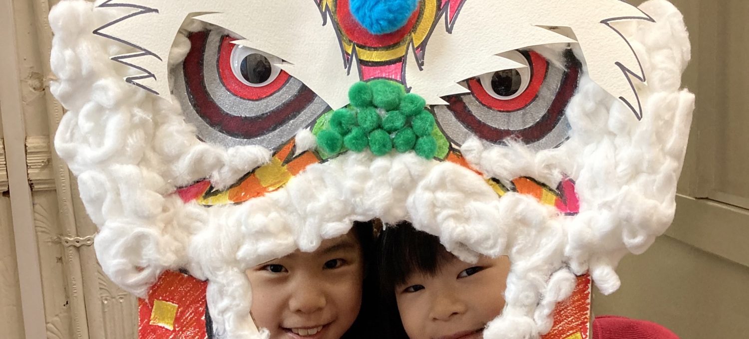 girls holding a chinese new year card