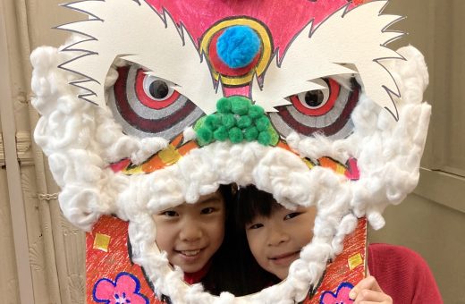 girls holding a chinese new year card