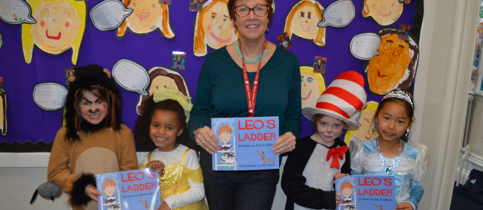 Teacher and students holding Leo's ladder book