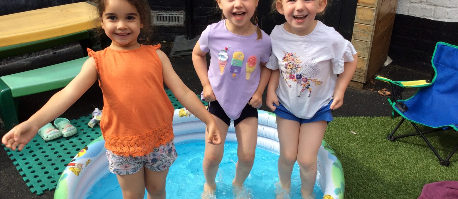 students in a paddling pool