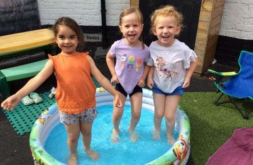 students in a paddling pool