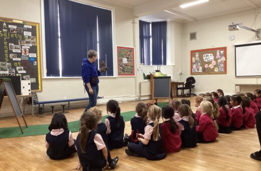 students looking at a bird