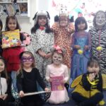 students and teachers in costumes