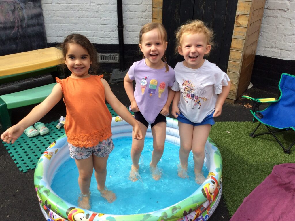 students in a paddling pool