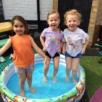 students in a paddling pool
