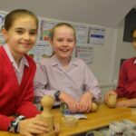 3 students in a baking session