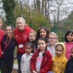 smiling students with teachers