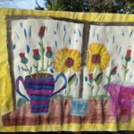 painting of flowers next to a window