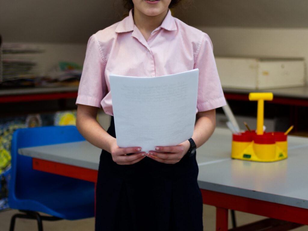 Girl holding a piece of paper