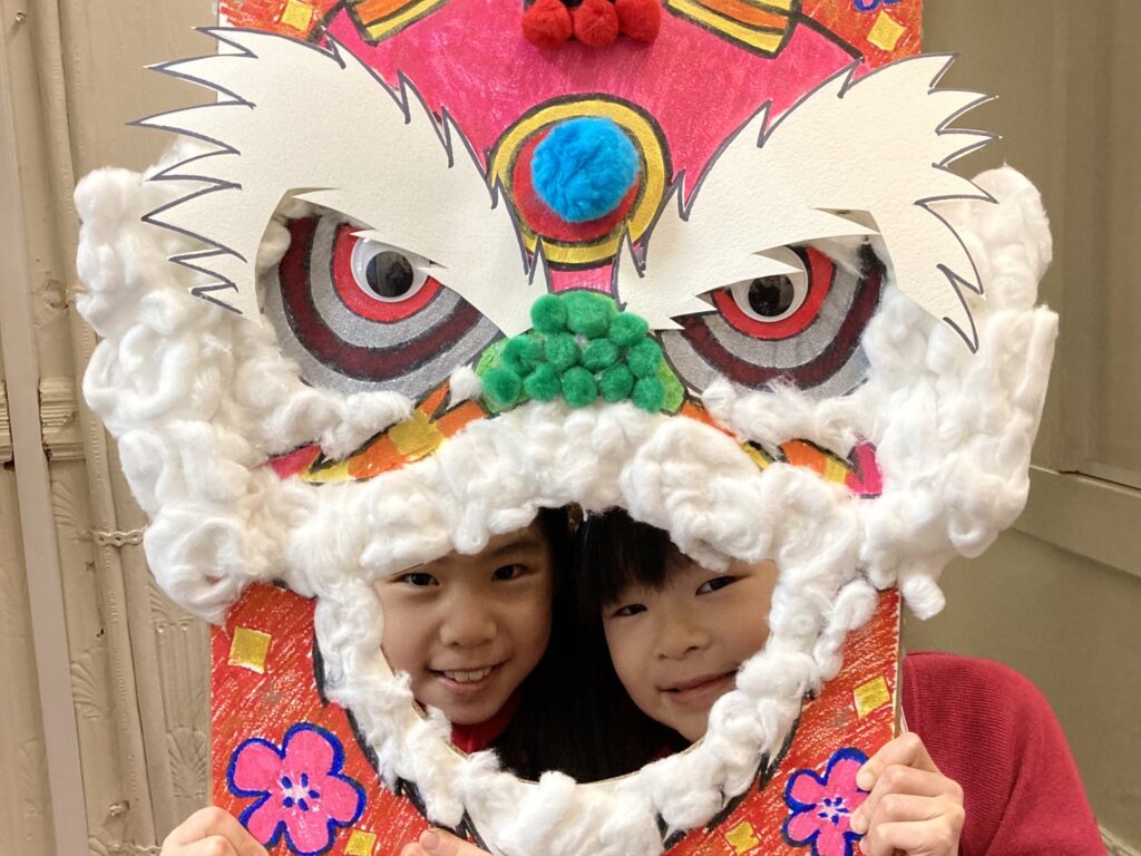 girls holding a chinese new year card