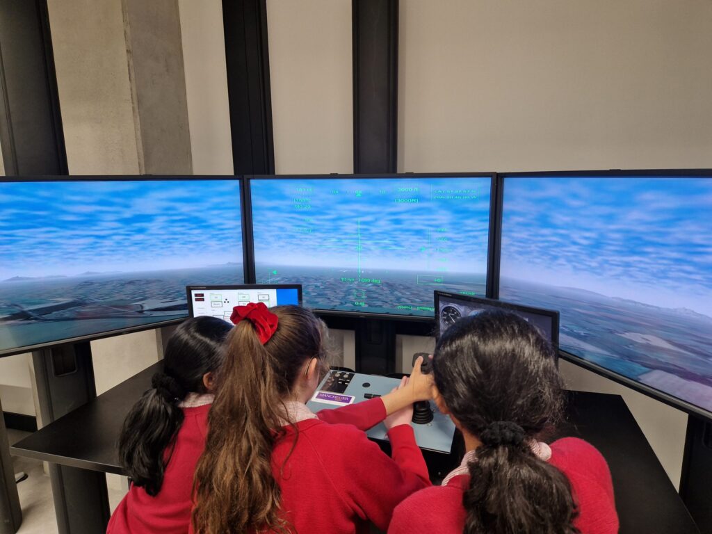 children in a flight simulator