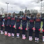 girls standing in a line in uniform