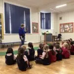 students looking at a bird