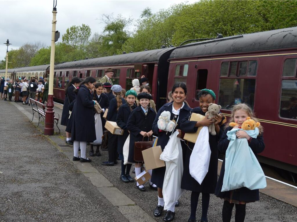 students by a train