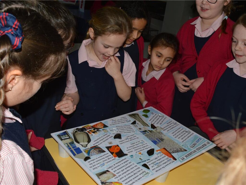 students reading a poster