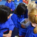 students holding animals